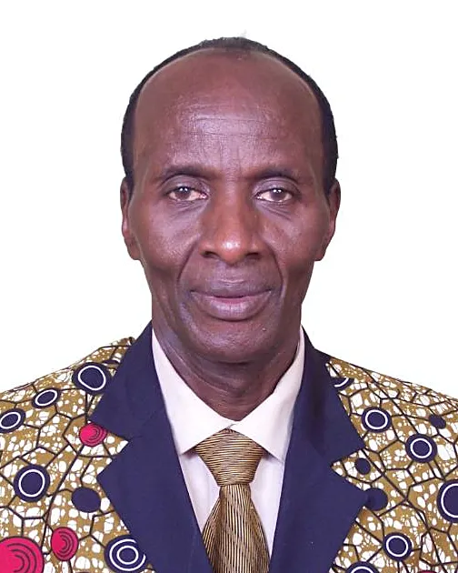 Elkanah Osinde, head and shoulders, wearing a patterned jacket and tie against a plain background
